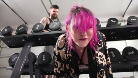 Inked slut plays dirty at the gym while faced with a big dick